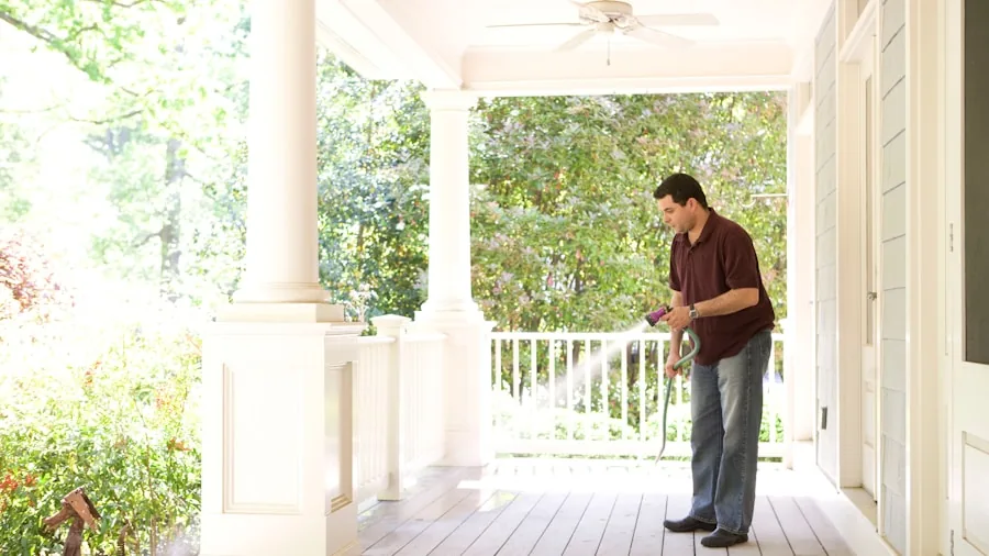 Person selecting from different pest control product types in home kitchen