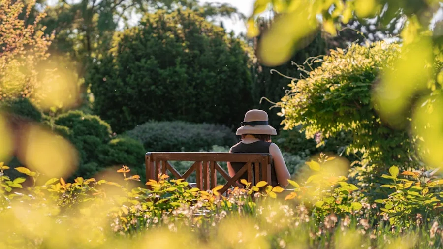 person sitting garden with feeder
