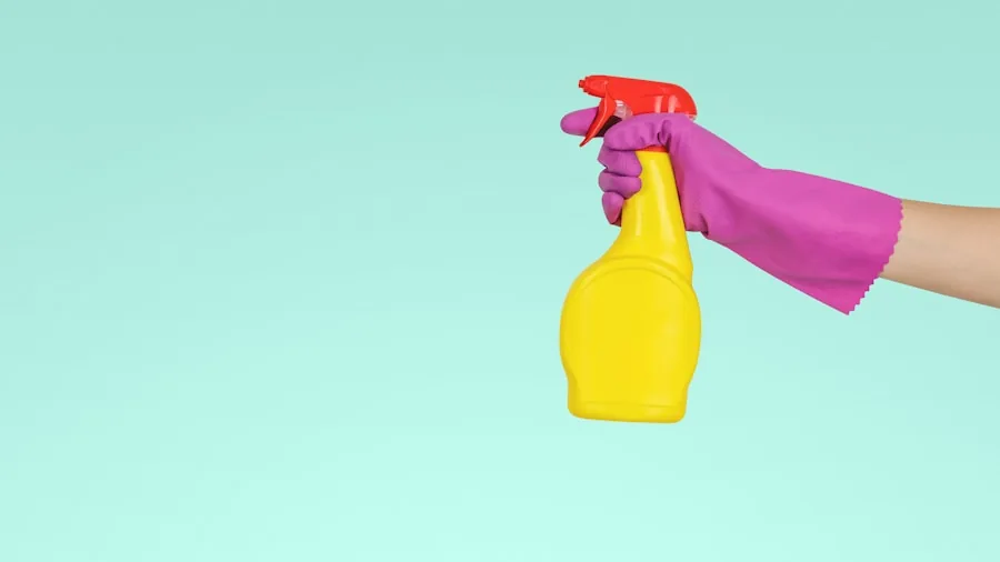 The %product_count% Best Roach Killers 2 Person spraying cleaning solution in kitchen cabinet during pest control maintenance