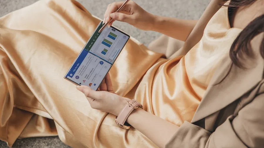 The %product_count% Best Blood Pressure Monitors 5 Person taking notes while reviewing personal health records and medical data on paper