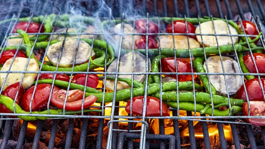 Person tending to grilled meats over smoky fire with wood smoke visible in outdoor backyard setting