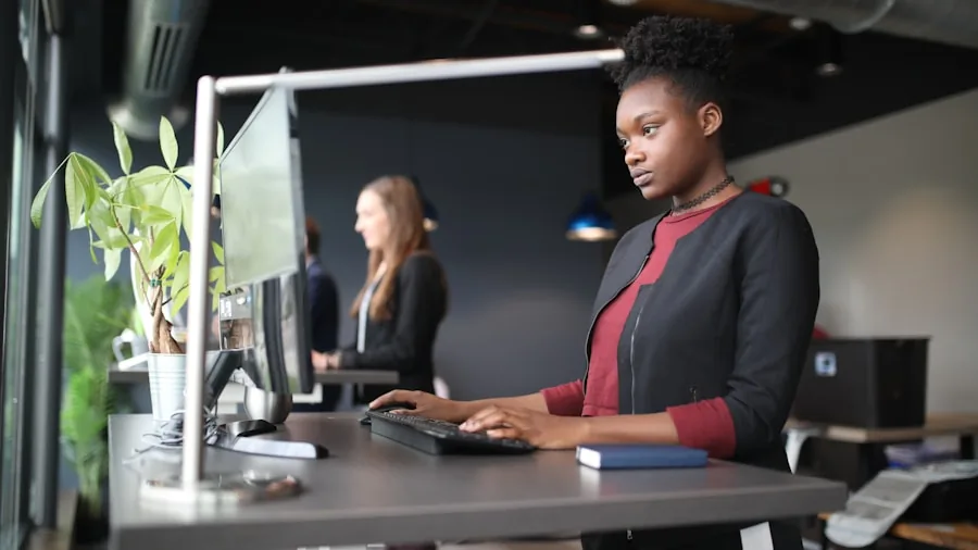 Person typing at desk with proper posture and ergonomic setup for comfortable long work sessions