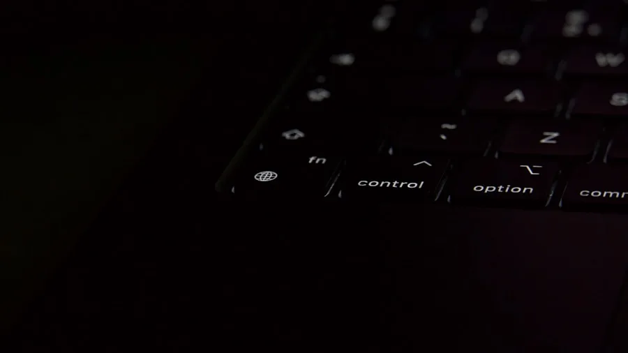 MacBook Keyboard Update: What Shoppers Need to Know About New Symbol Keys and Missing Features 2 person typing at night low light