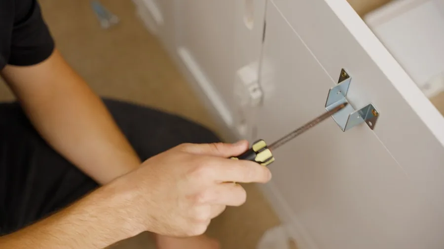 The 8 Best Cordless Drills 5 Person using cordless drill to assemble wooden furniture in bright home workspace