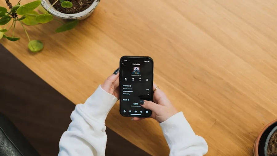 Person using smartphone app to customize audio settings and equalizer controls on wireless earbuds