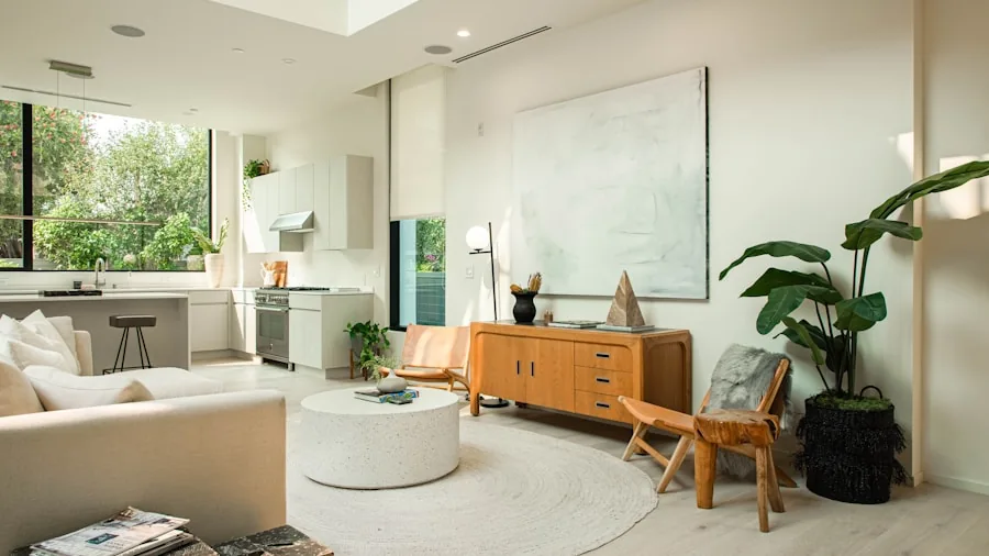 Person using smartphone to control smart home devices in modern living room setting