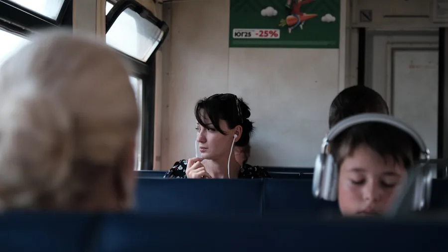 Person wearing earbuds on public transport, focused on blocking out ambient noise in urban environment