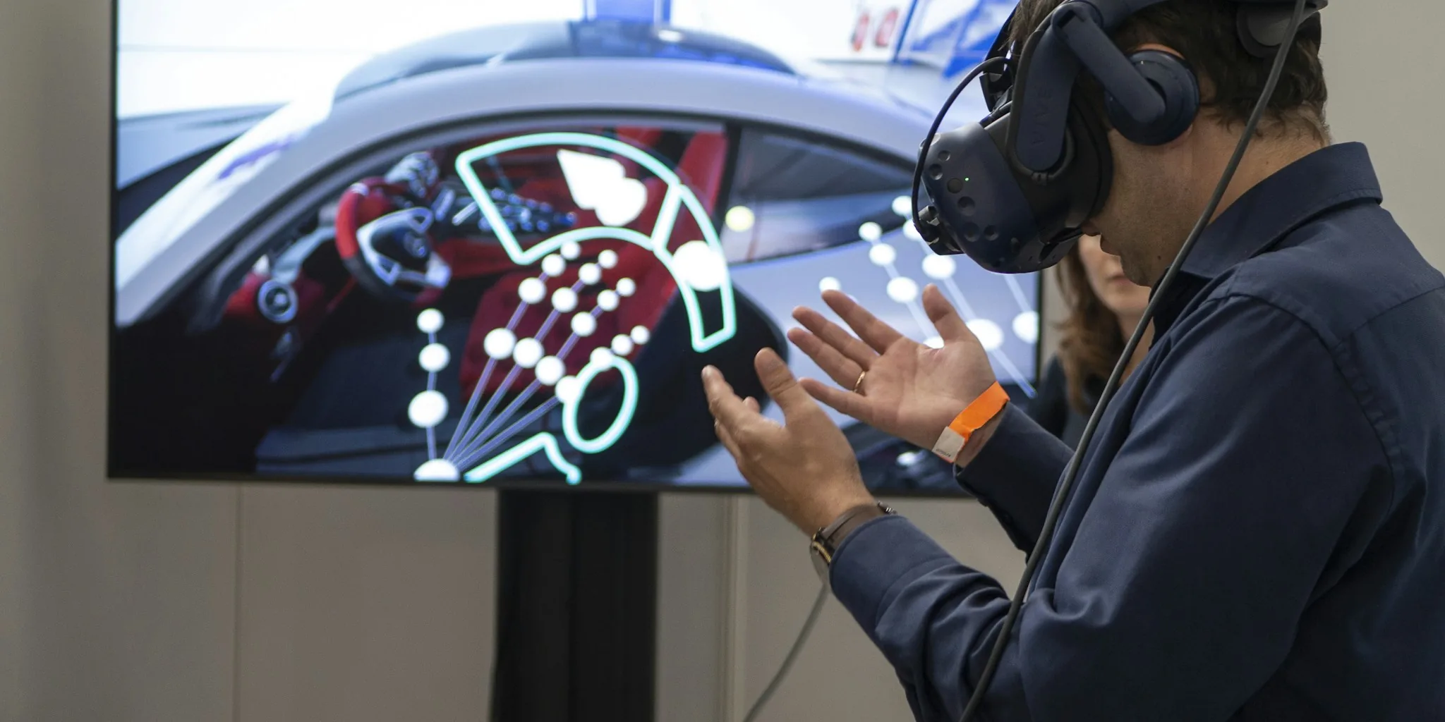Person wearing VR headset with hands extended while playing immersive virtual reality game