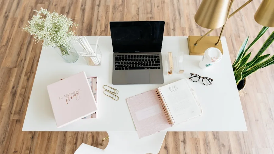 Person working at small desk in minimalist home office with organized storage and natural lighting