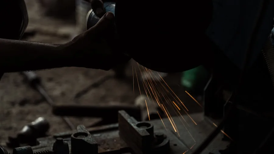 Person working in organized garage workshop with tools and equipment on workbench