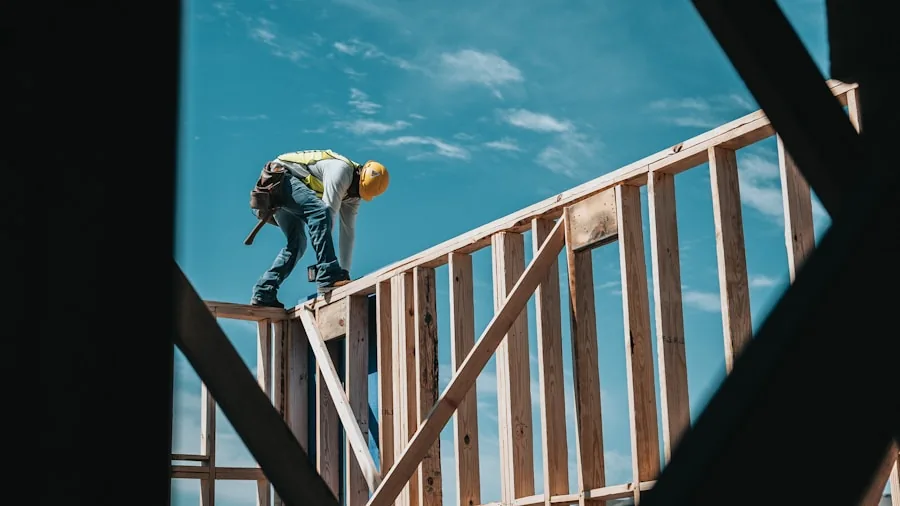 The 12 Best Nail Guns 2 Professional carpenter driving nails into wooden frame during residential construction project