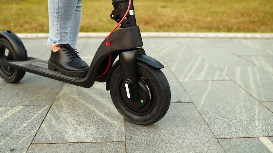 Professional commuter riding electric scooter on city street during daytime