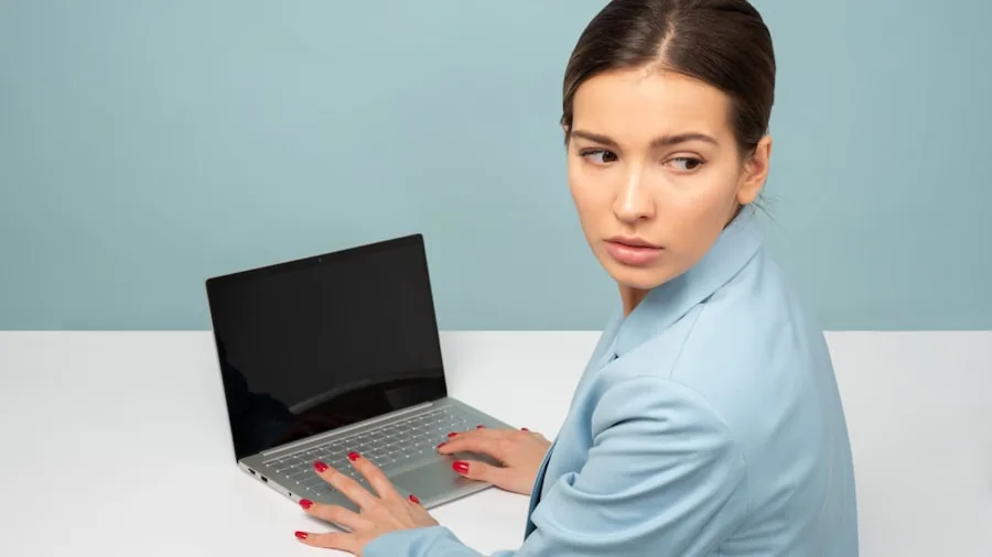 MacBook Overhaul Coming: What Shoppers Need to Know About Apple's 2026 and 2027 Lineup 3 professional looking at laptop screen