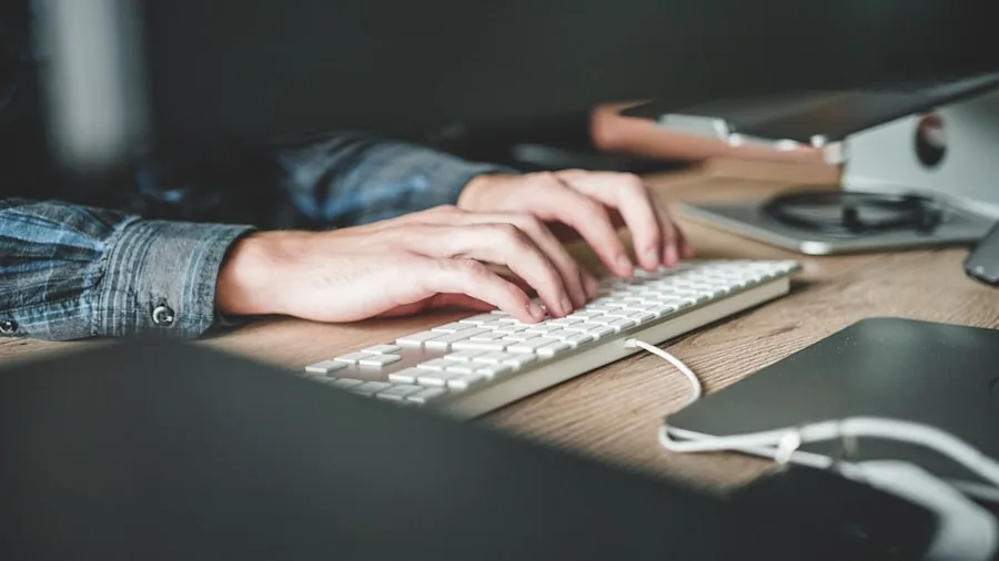 The %product_count% Best Laptops for Photo Editing 6 Professional photo editor typing at laptop keyboard during long editing session