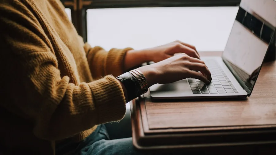 Professional sitting at desk with good posture while working on computer in home office