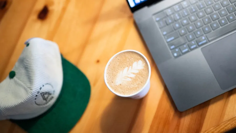 The %product_count% Best Laptops for Video Editing 5 Professional video editor working on laptop in coffee shop during daytime with natural lighting