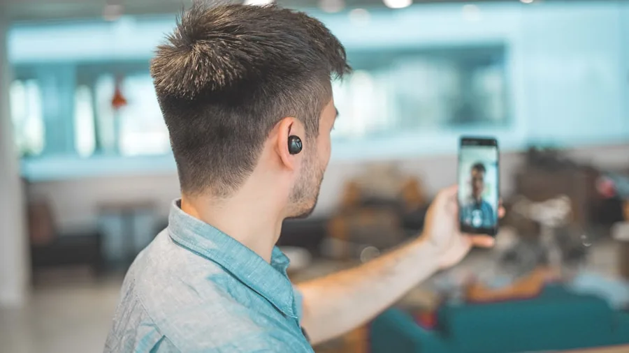 Professional wearing headset during video conference call at home workspace