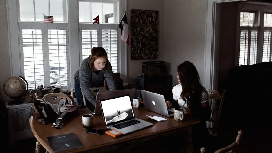 Professional working at desk with computer monitor, keyboard, and mouse during focused work session