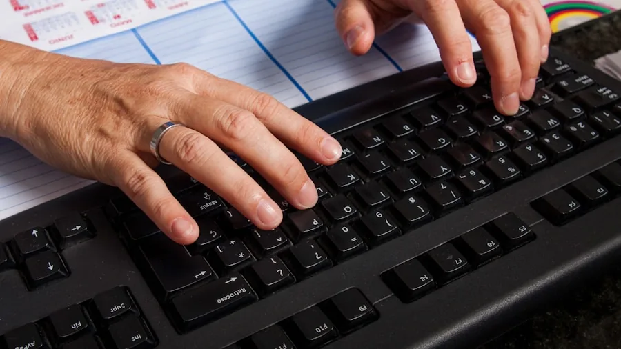 Professional working at desk with keyboard doing data entry and spreadsheet work