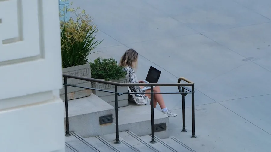 Professional working on laptop during business travel in natural outdoor setting