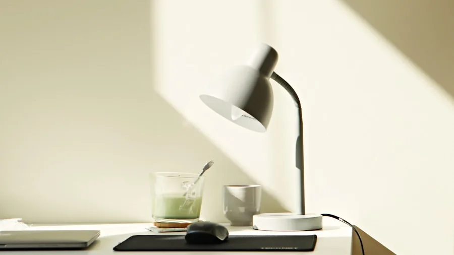 Professional workspace with quality metal desk lamp providing focused lighting over organized work area
