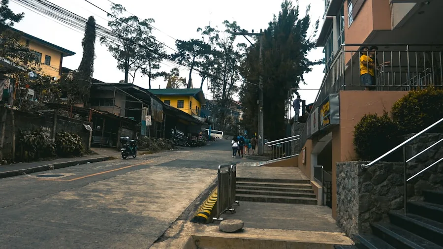 Rider on electric scooter climbing a steep urban hill demonstrating motor power and performance