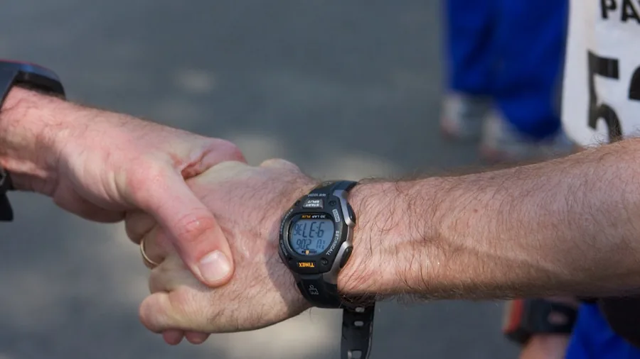 Marathon Goal Pace Workout: Are You Ready to Hit Your Target Time 2 runner checking pace watch tired effort