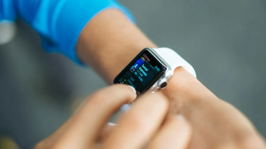 runner checking smartwatch pace