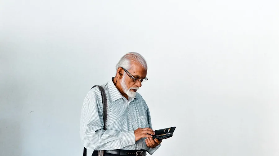 The %product_count% Best Senior Phones 5 Senior adult reviewing mobile phone documentation and activation instructions at home
