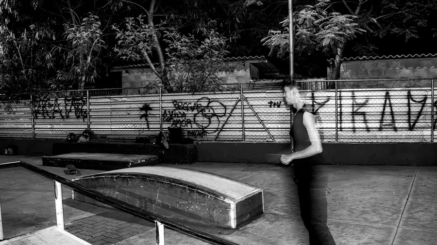Skateboarder performing a trick on concrete rail during daytime skating session