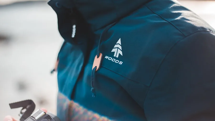 The %product_count% Best Ski Jackets 4 Skier checking jacket pockets and features while preparing for day on snowy mountain slopes