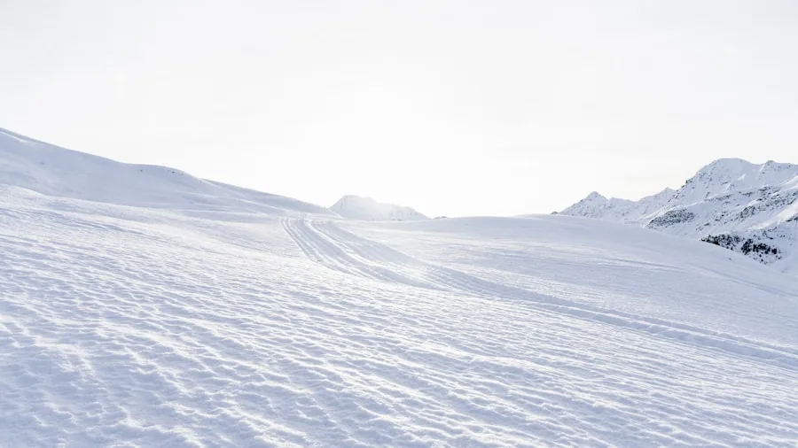 The %product_count% Best Ski Jackets 3 Skier in motion demonstrating arm mobility and proper posture while descending a snow-covered mountain slope
