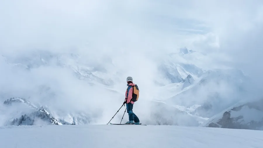The %product_count% Best Ski Jackets for Men 2 Skier navigating through snowy alpine terrain on a mountainside