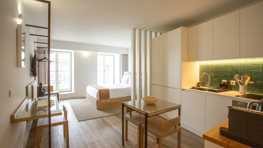 Small modern kitchen countertop with limited space and organized appliances in a cozy apartment setting
