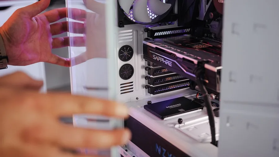 The %product_count% Best Graphics Cards for Gaming 3 Someone assembling a gaming PC in a compact computer case, checking component fit and compatibility