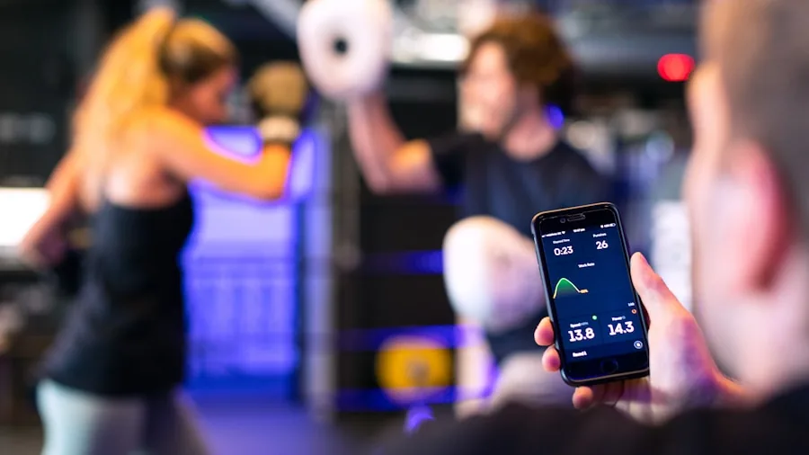 The %product_count% Best Stationary Bikes for Home 5 Someone checking workout metrics on smartphone while exercising indoors