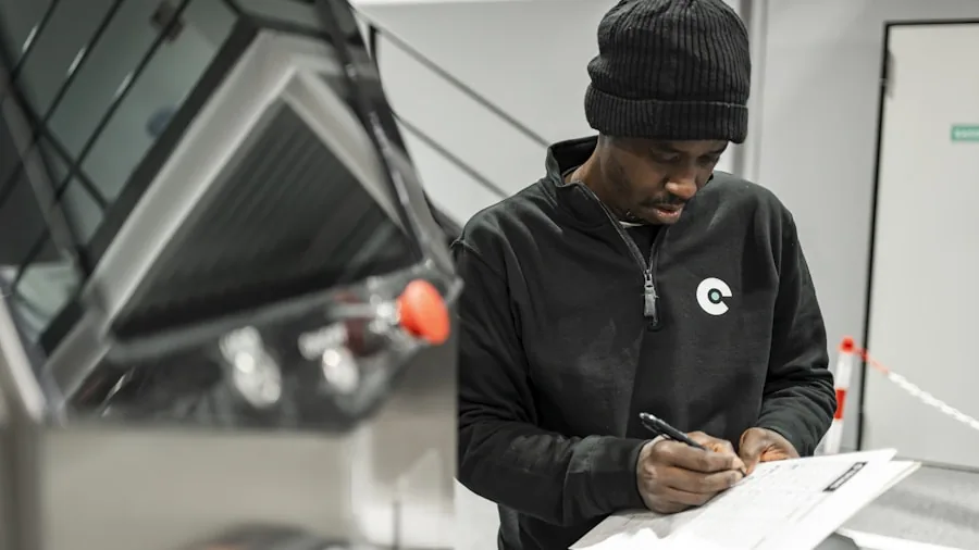 Someone closely examining technical details and specifications on a document or screen
