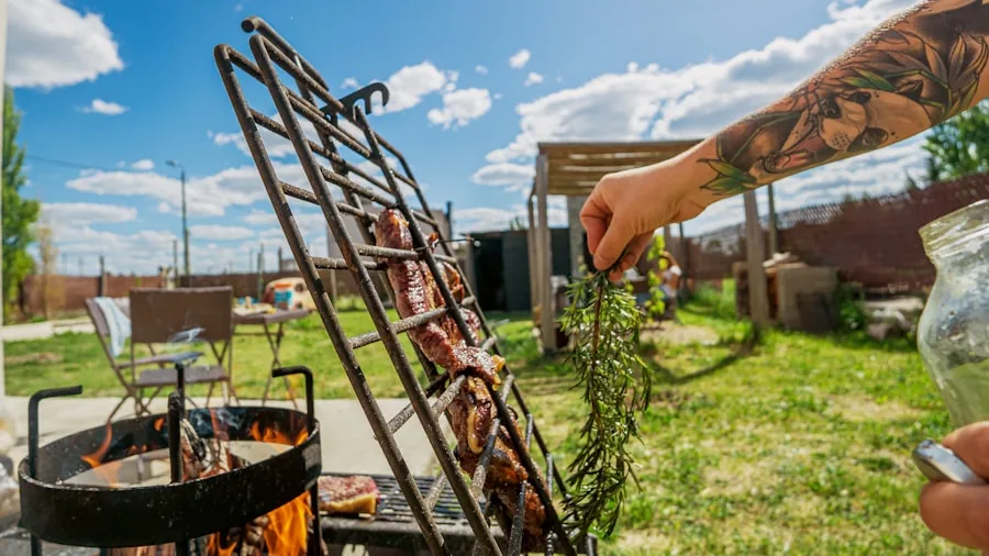 Someone examining a stainless steel grill surface outdoors in natural lighting