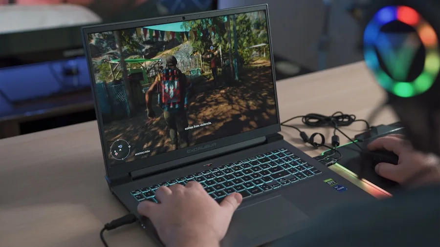 Someone focused on gaming laptop at desk with natural lighting and casual workspace setup