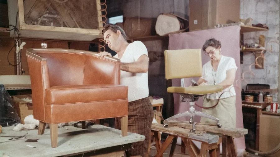 The 12 Best Sofas 6 Someone thoughtfully examining fabric texture and construction details of home furniture in natural light