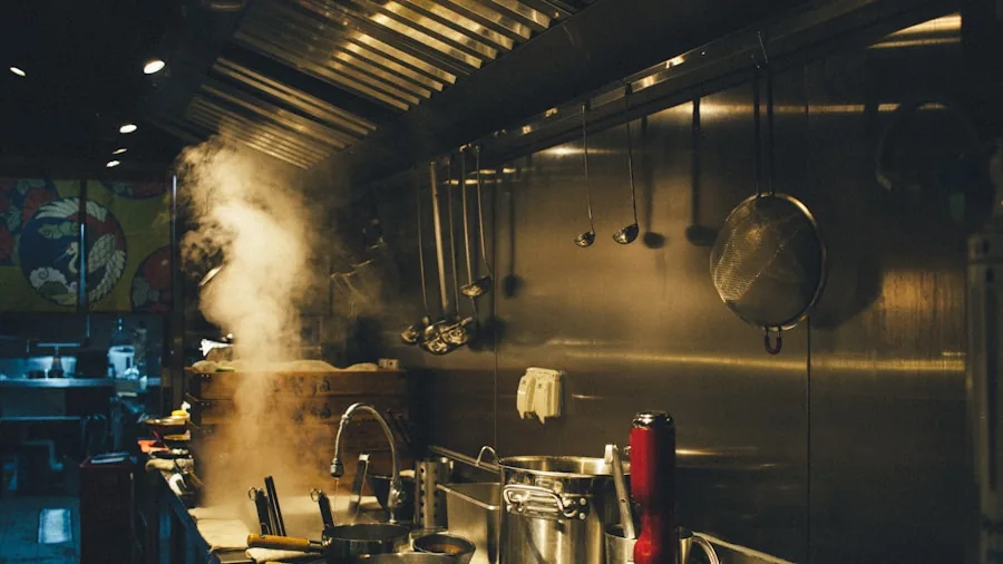 The %product_count% Best Ranges 4 Steam rising from stovetop with range hood ventilation system in modern kitchen during cooking