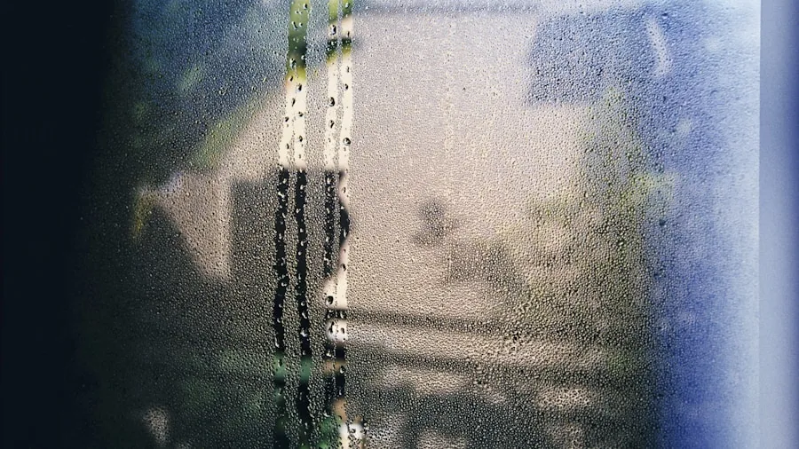 Steamy bathroom mirror with water droplets and condensation from hot shower