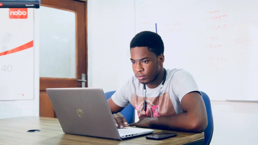 Student focused on laptop while studying, representing processor performance for academic work