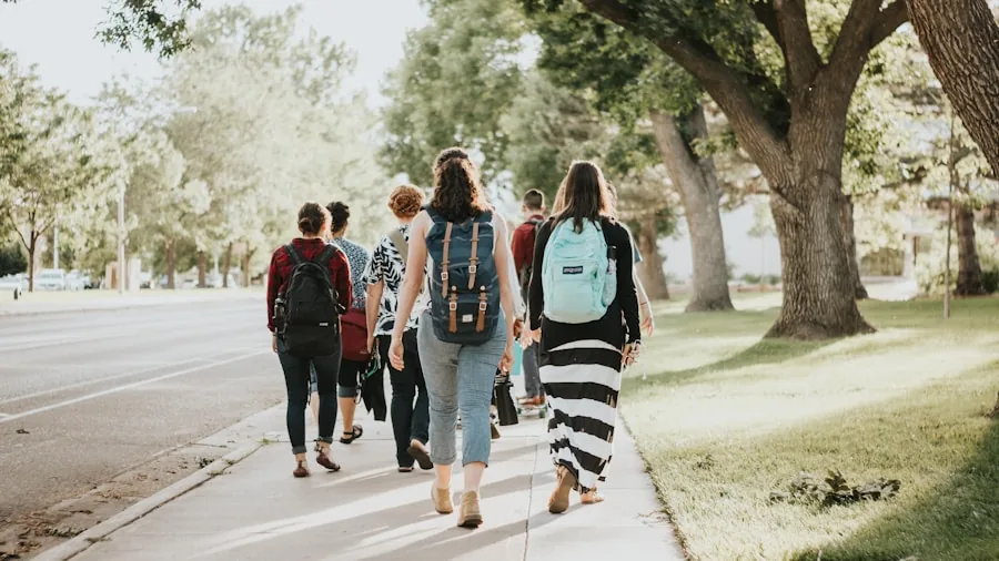 The %product_count% Best Laptops for Colleges 5 Student walking across campus with backpack full of books and laptop