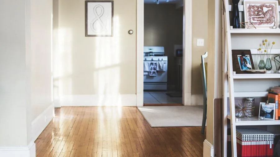 Stylish home entryway with wooden furniture and organized storage reflecting interior design choices