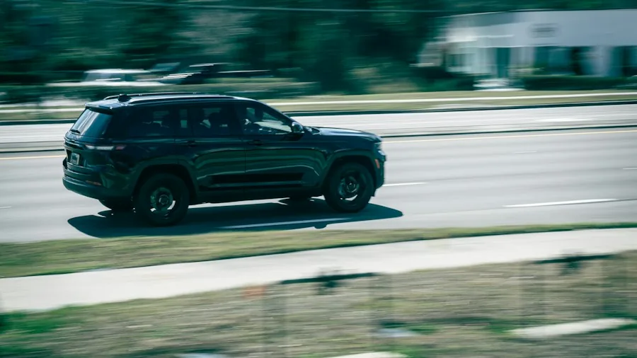 SUV driving modern highway