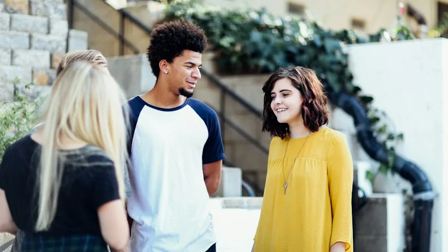 Parenting Sons to Stand Up Against Peer Pressure: What Experts Recommend for Buyers 2 teenagers talking diverse group