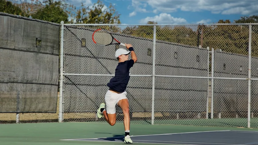 Tennis player performing a serve on outdoor court during match, showing athletic motion and footwork