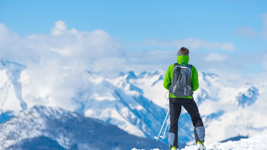 Tired skier taking a break on snowy mountain slope during long day of skiing