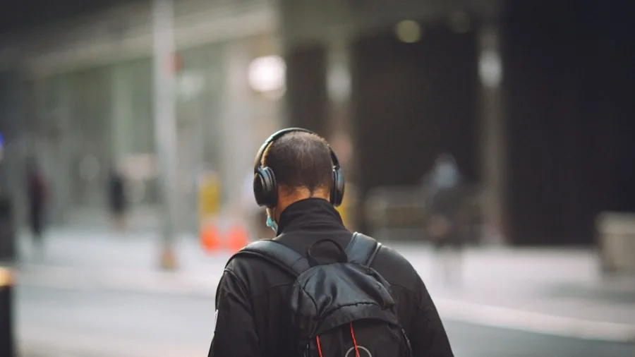 Traveler wearing earbuds on airplane, demonstrating noise cancellation in real travel environment